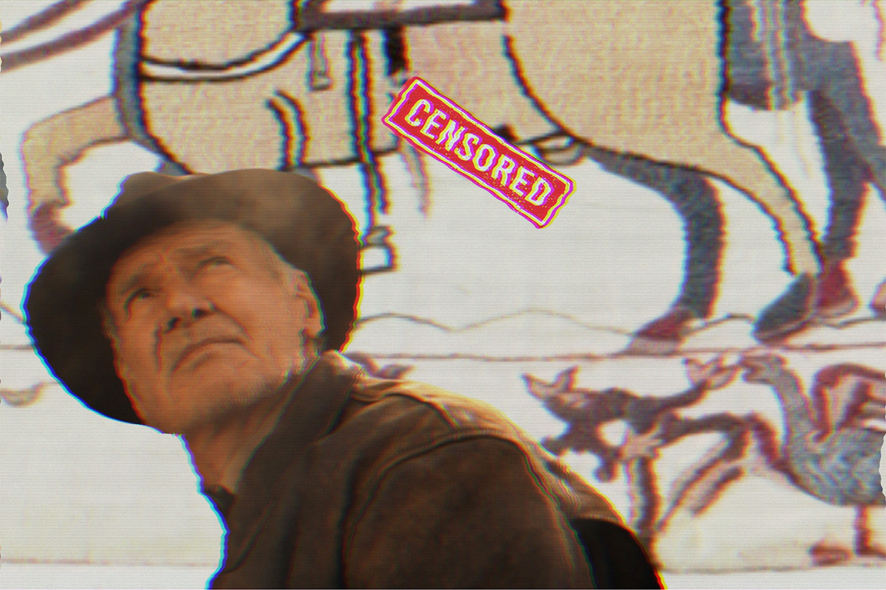 Indiana Jones looking at censored tapestry of horse penis