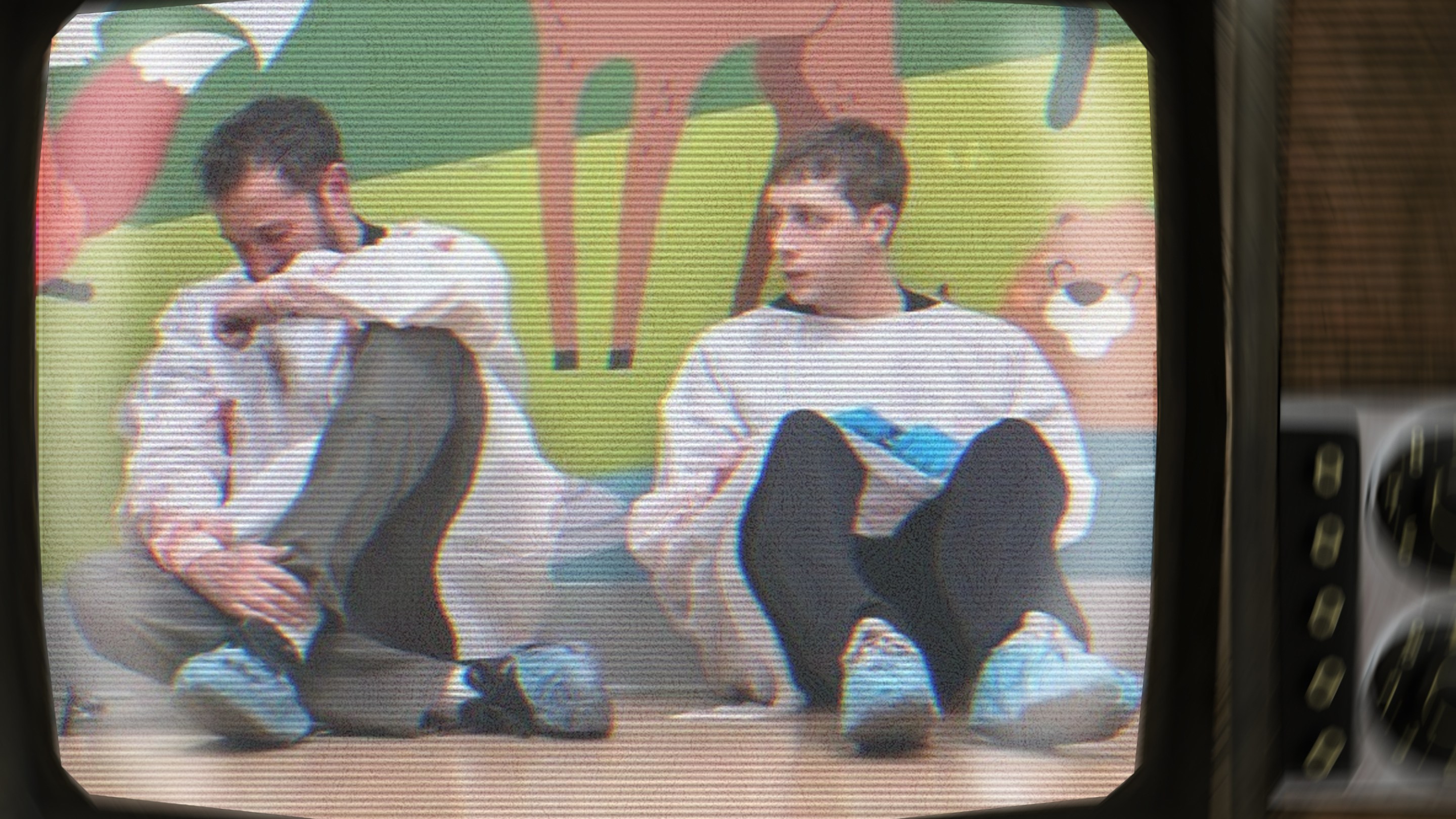 The Pitt doctors sitting against children's ward wall