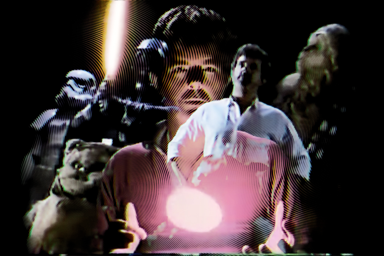 George Lucas looking into egg in front of himself standing in front of Star Wars characters