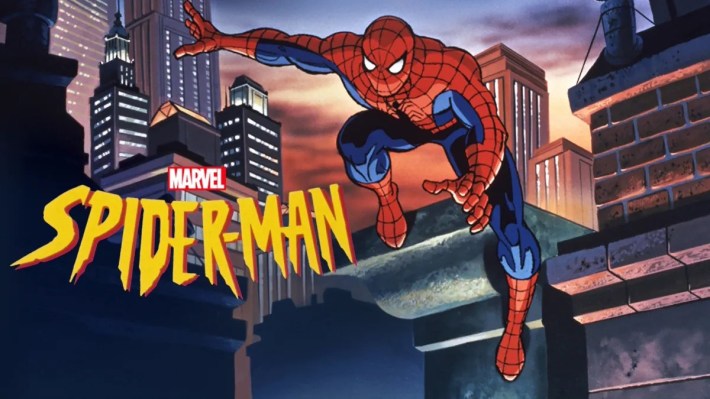 Spider-man, in blue and red, leaps over a building.