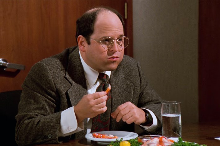 George eating shrimp