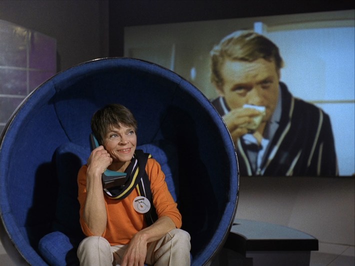 two on phone in front of camera footage of six shaving