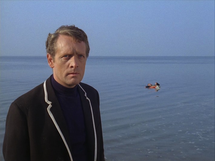 Six in front of dead floating body
