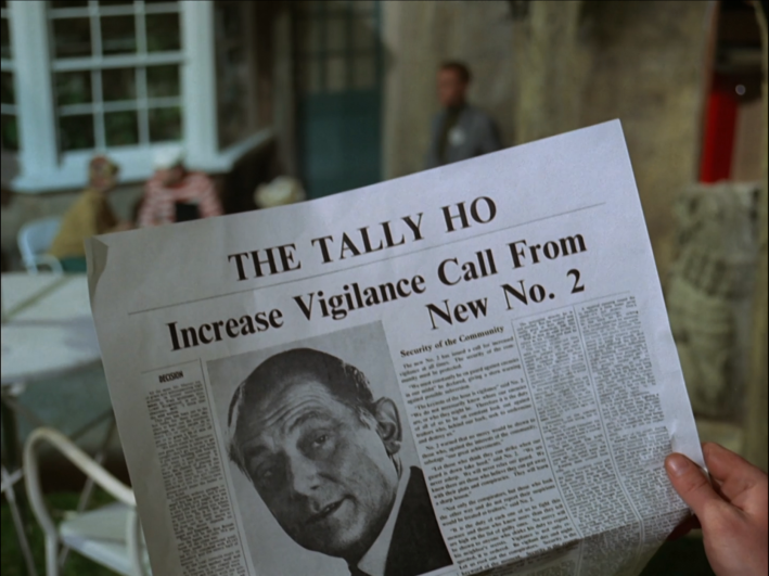 A newspaper reads "The Tally Ho: Increase Vigilance Call From New No. 2"