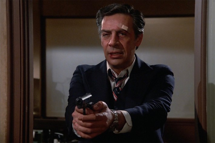 Harry McGraw with gun drawn
