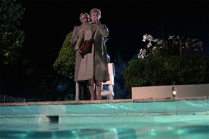 Jessica and man at poolside
