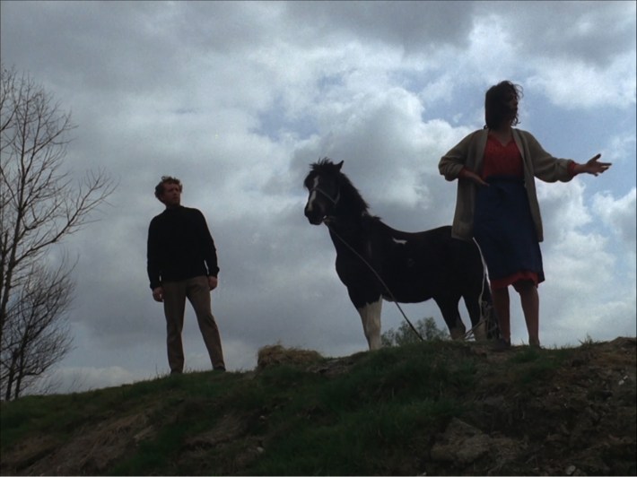 Six on hill with woman