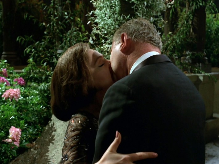 Colonel Six kissing woman