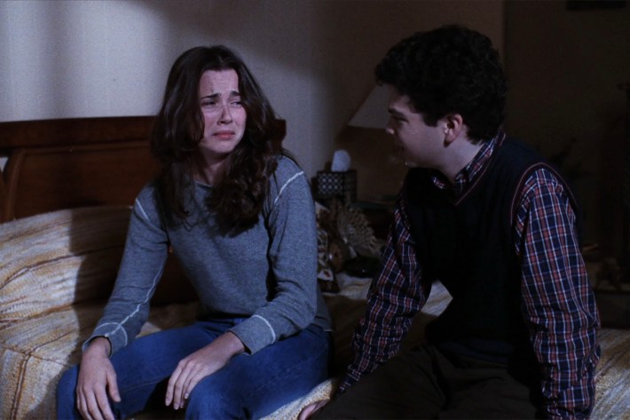Lindsay and Neal on bed, Lindsay crying