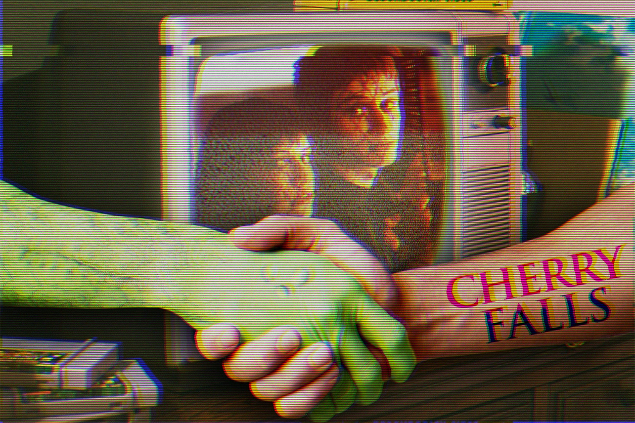 Monster shaking hands with arm with Cherry Falls tattoo in front of an old TV playing Cherry Falls