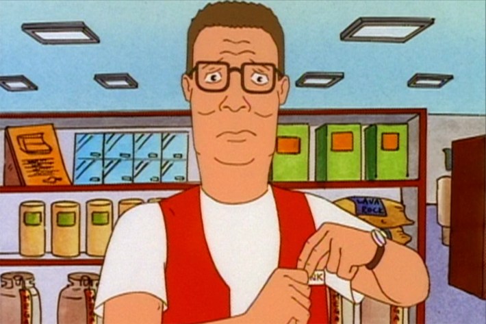 Hank affixing nametag to vest