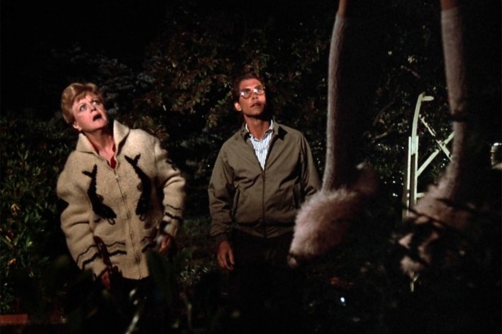 Jess and dweeb looking at woman hanging from tree in fluffy slippers