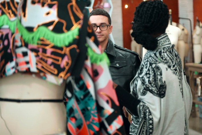 Christian looking at Joan's fabric