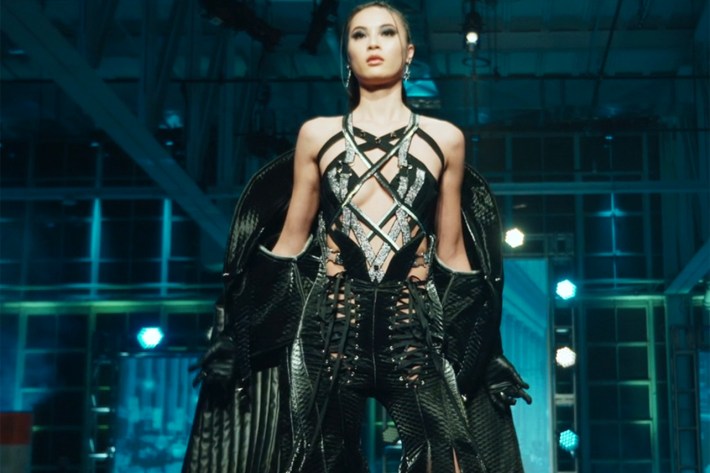 Model in black quilted leather straps and jacket