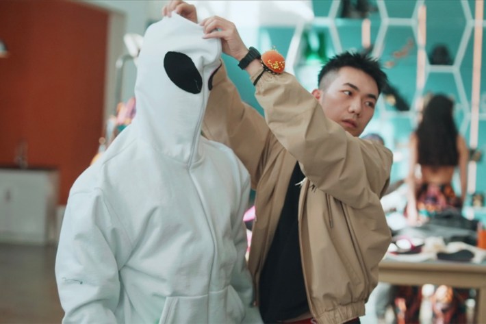 Yuchen with model in white hood