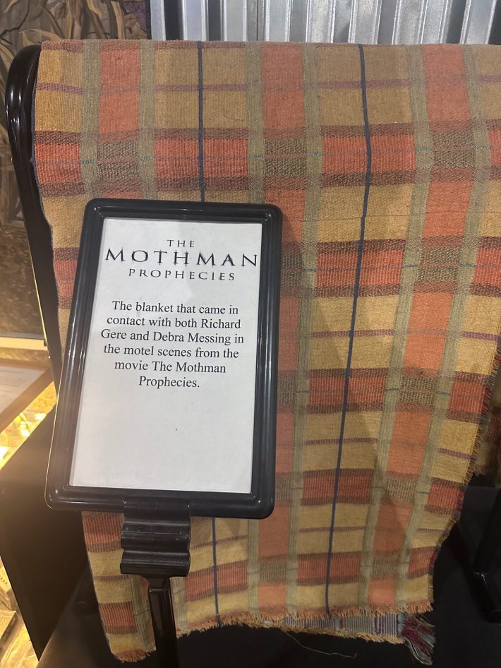 A blanket with a sign saying it came in contact with both Richard Gere and Debra Messing.