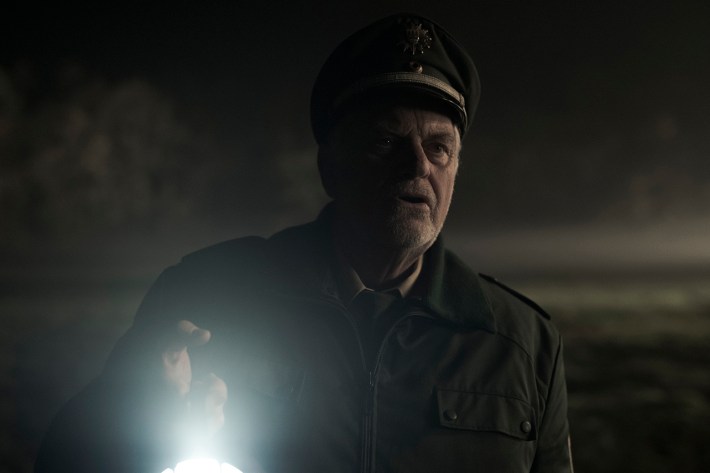 Egon in dark with flashlight