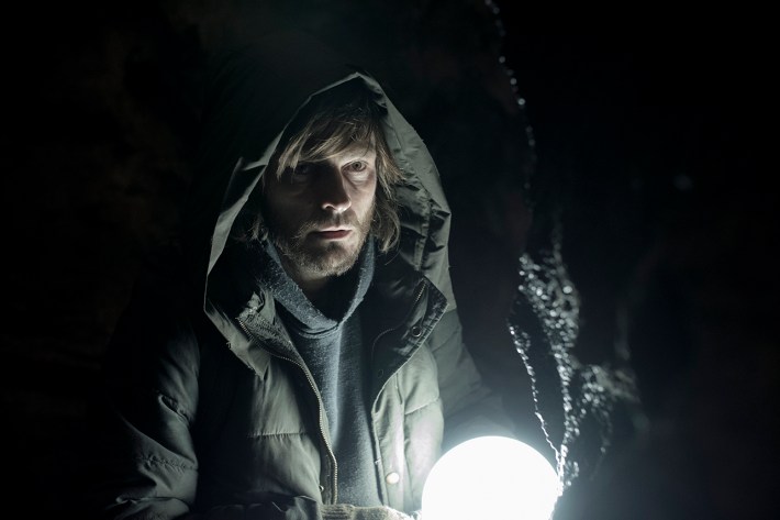 The Stranger outside in dark