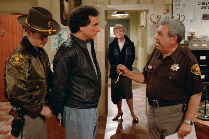 Suspect in cuffs, with Jessica and Amos