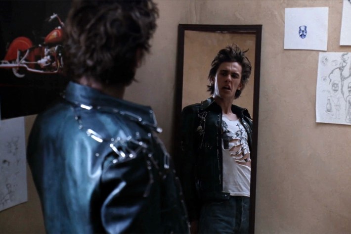 Daniel in punk outfit in front of mirror