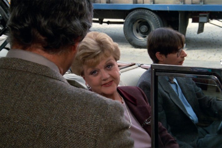 Jessica with dweeb in cool old car