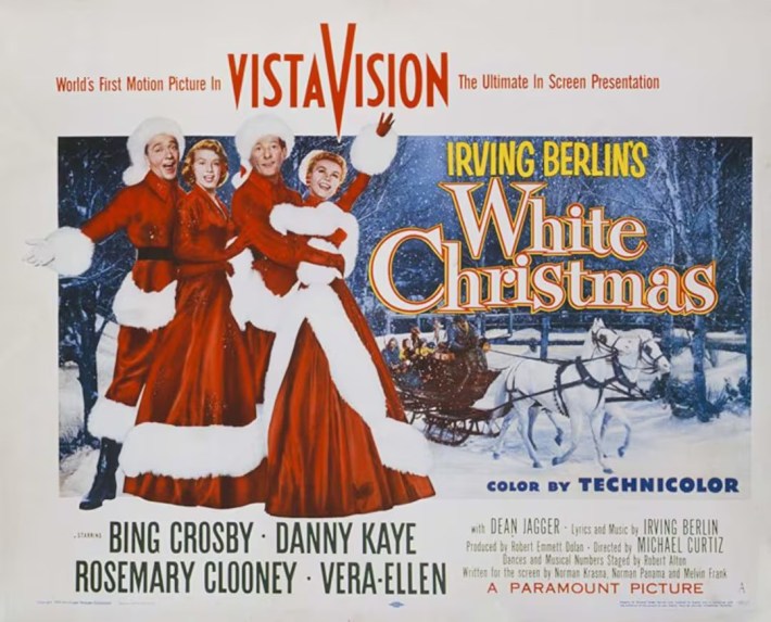 Movie poster for White Christmas, with people dressed in red and white furs.