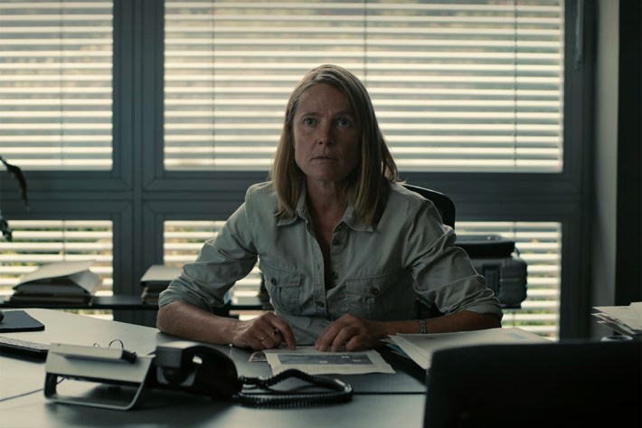 Detective behind desk