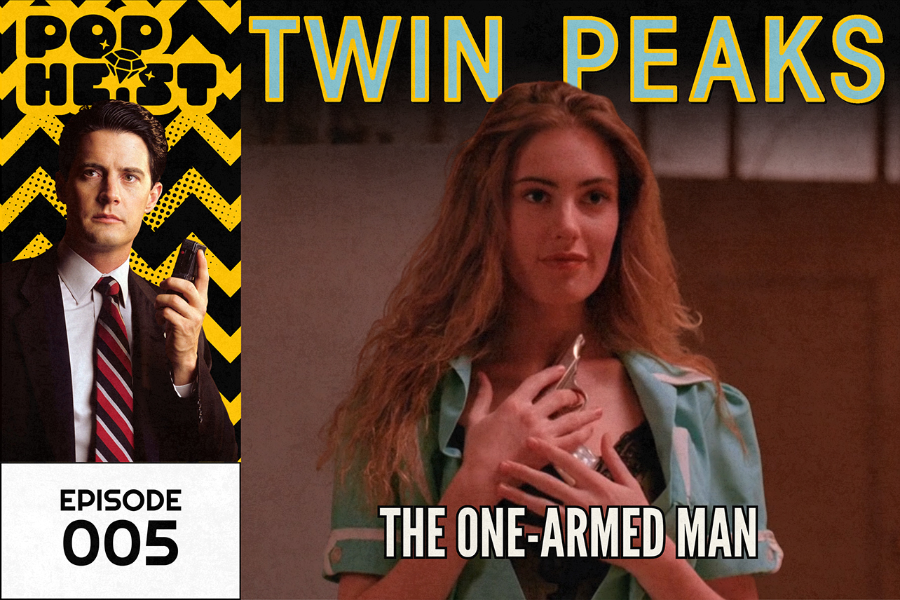 Woman in black teddy cuddling a gun