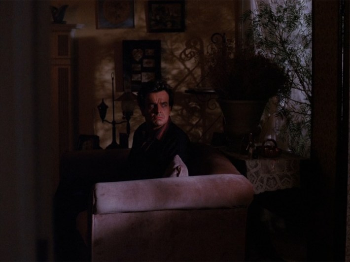 Leland in living room with lights out.