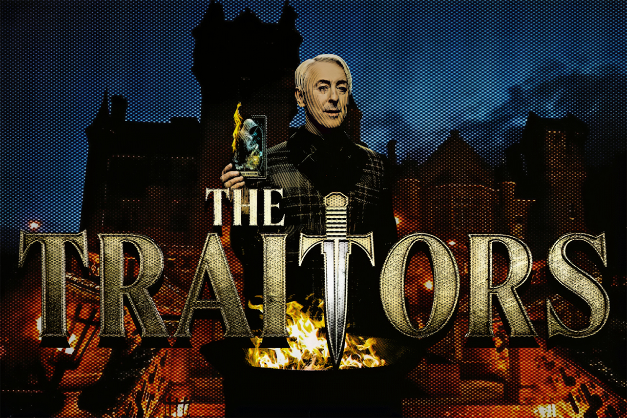 Alan Cumming behind logo and in front of castle