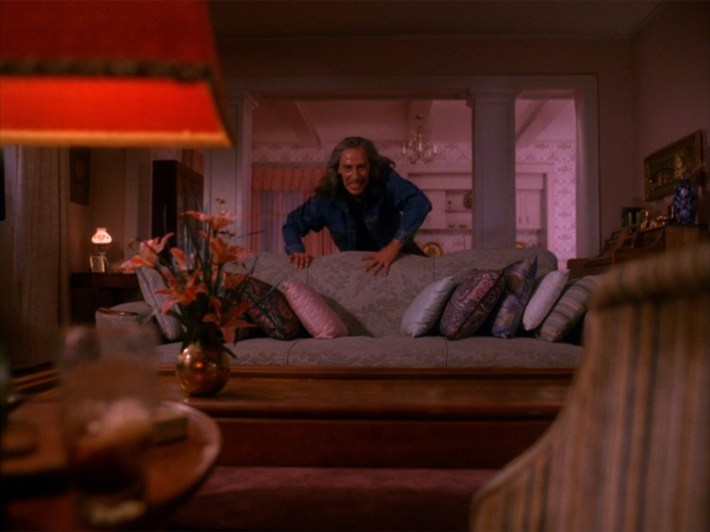 Bob crawling over couch