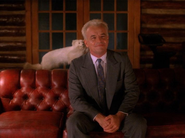 Leland smiling on couch