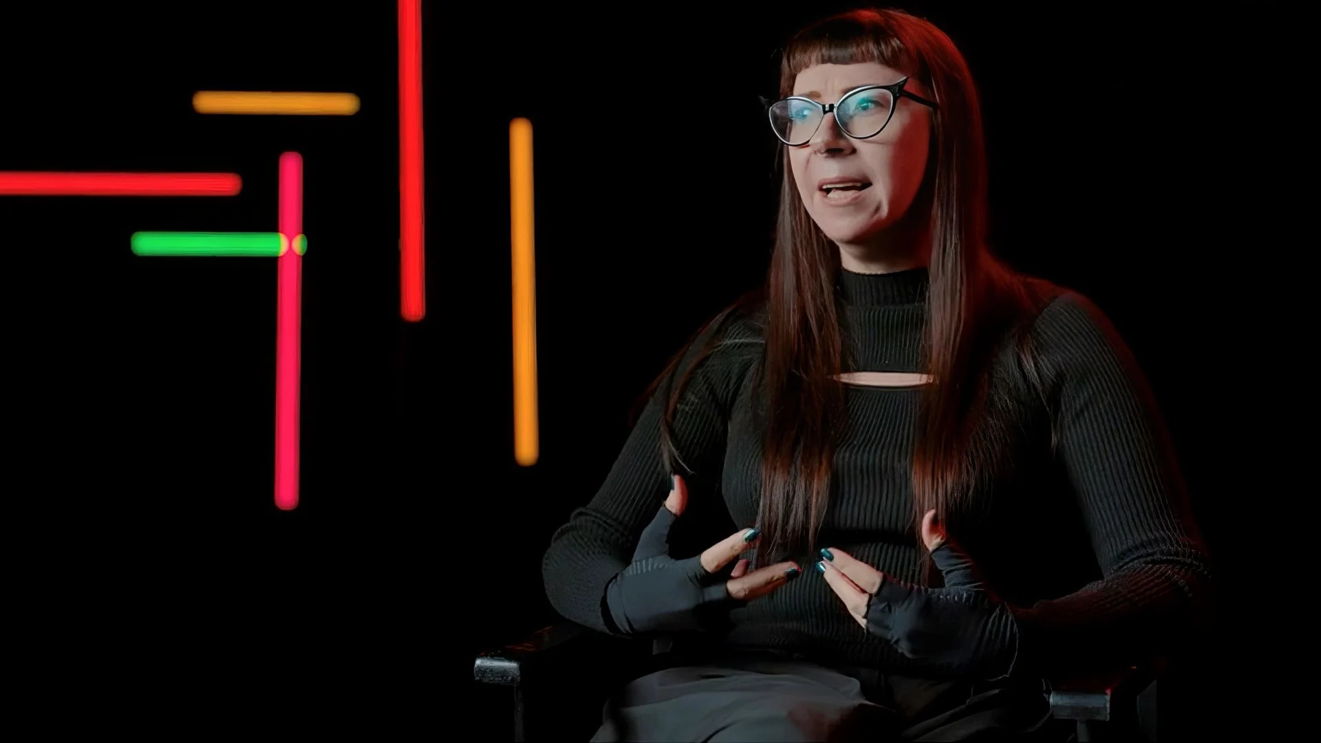 Woman sitting being interviewed