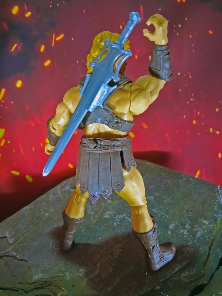 He-Man back, grabbing sword