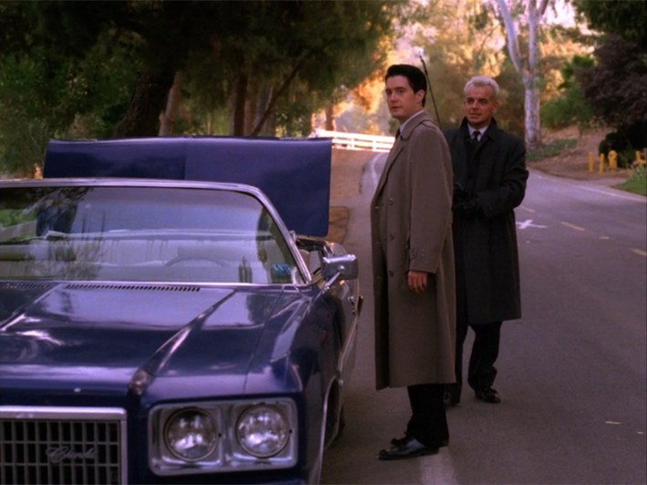 Leland's car pulled over, Cooper beside it