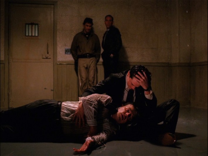 Coop cradling Leland's body