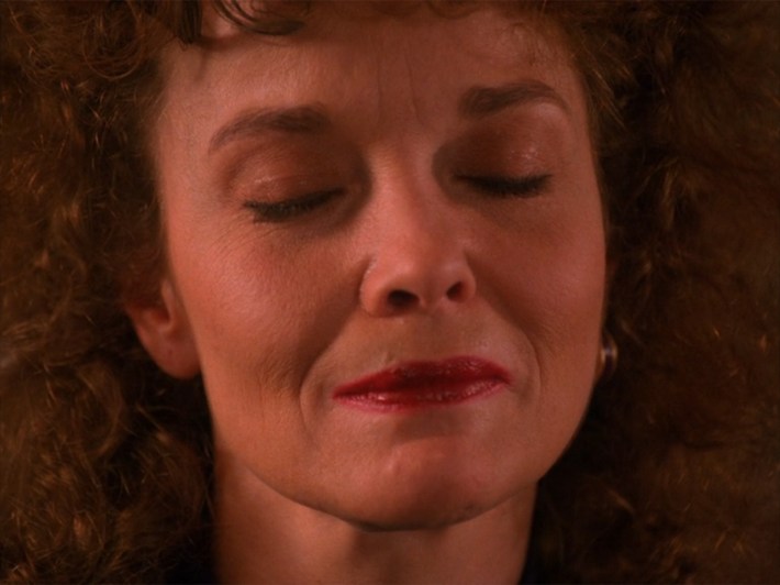 Woman with eyes closed