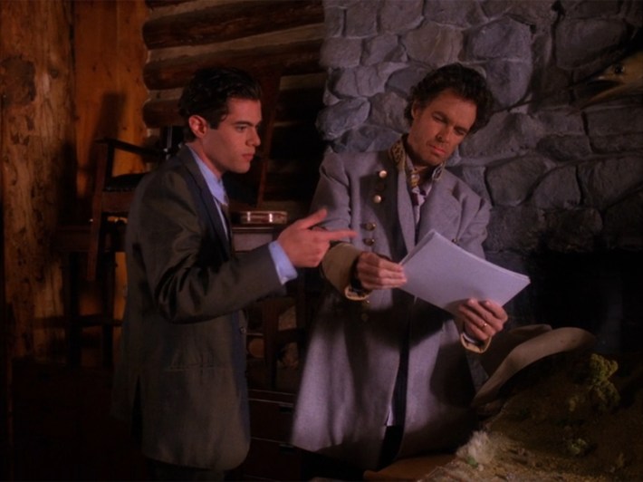 Ben Horne with papers showing to man