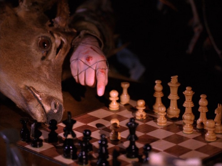 Dead hand pointing at chess board