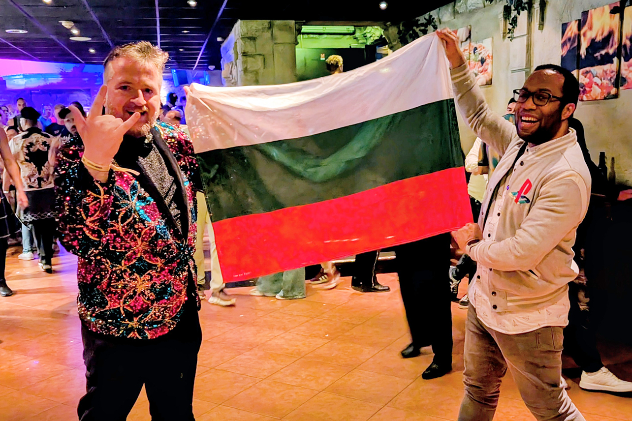 Dimitry and man holding Bulgarian flag