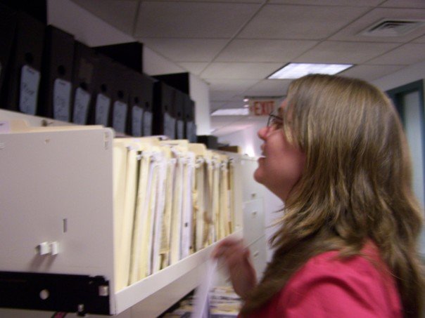 Ashley looking into a celeb file