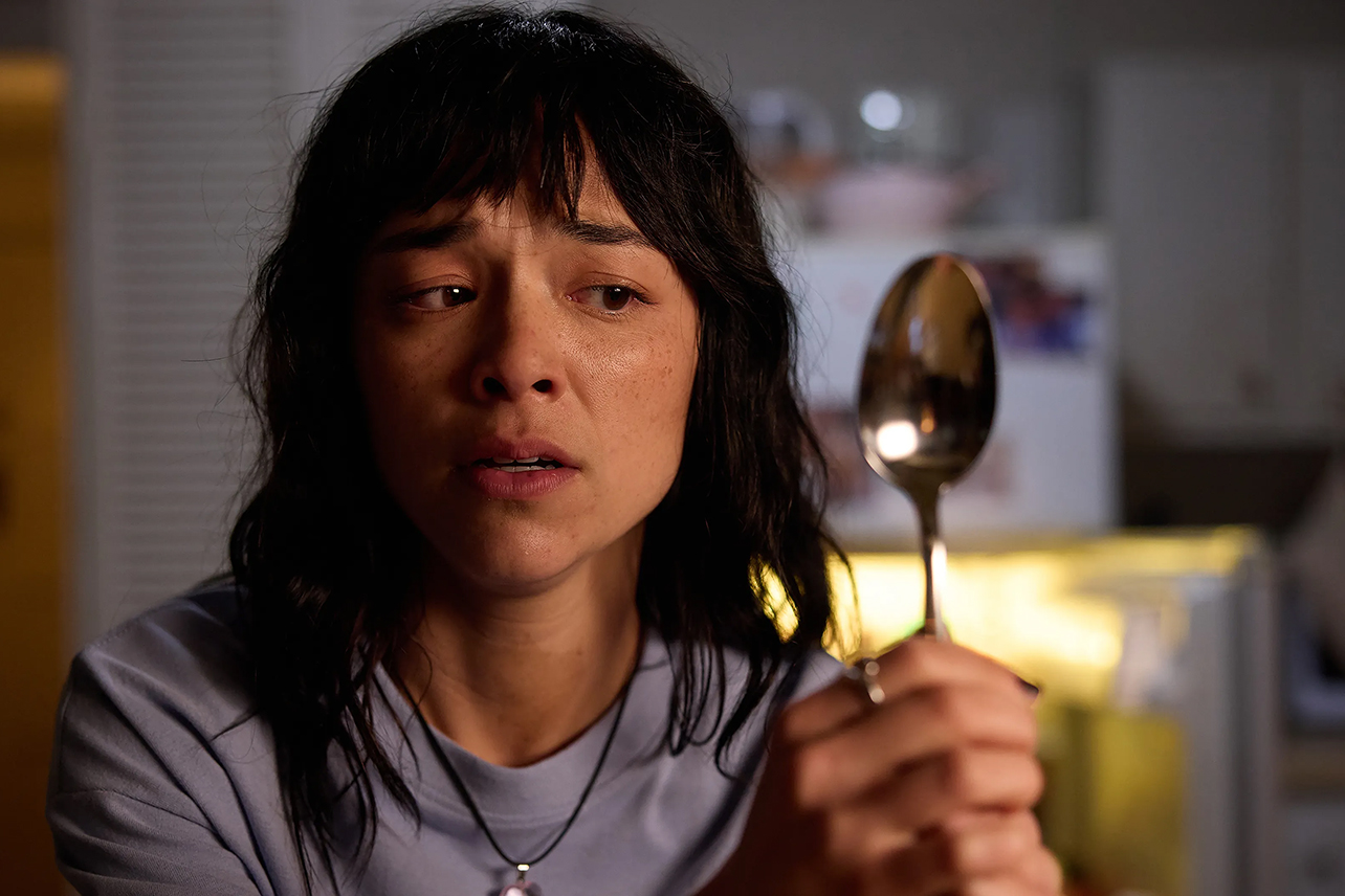 Hana looking in spoon reflection