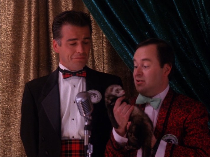 Men in tuxes with a weasel