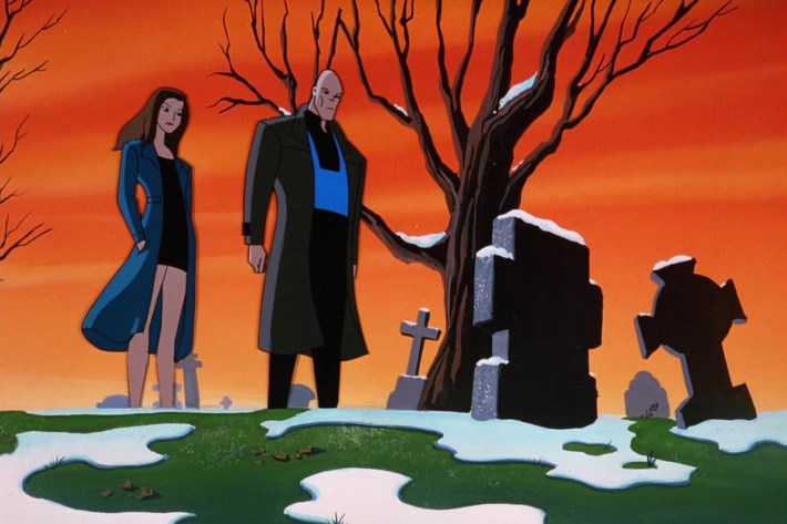 Two people at snowy grave