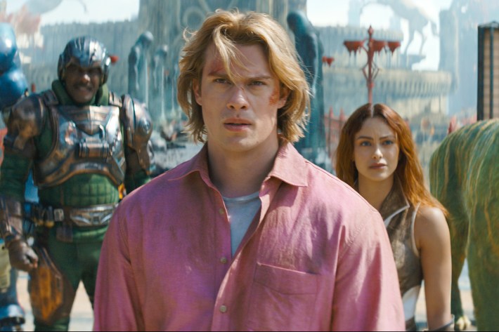 Man At Arms (Idris Elba), Adam (Nicholas Galitzine), Teela (Camila Mendes