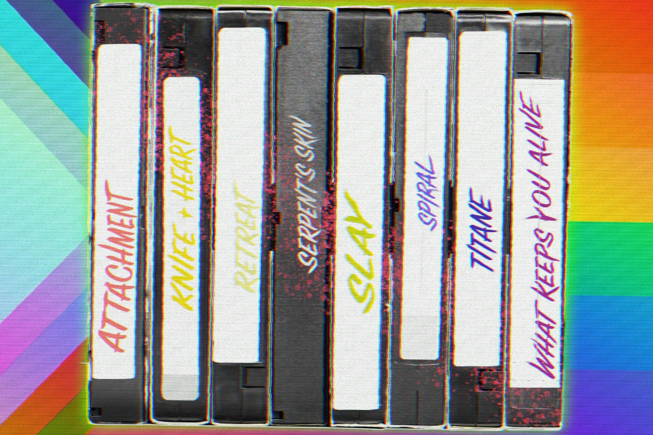 VHS tapes in front of rainbow flag
