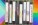 VHS tapes in front of rainbow flag