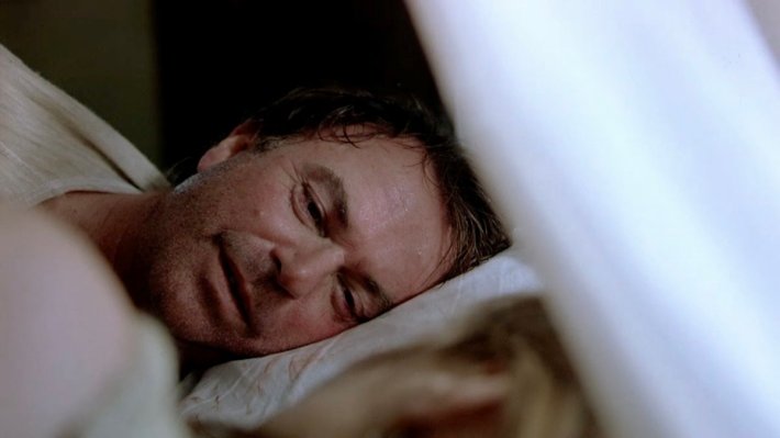 Sam Neill in bed