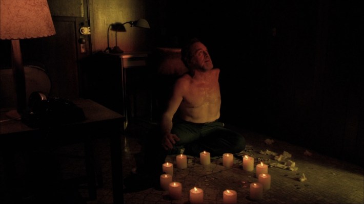 One-armed man doing ritual