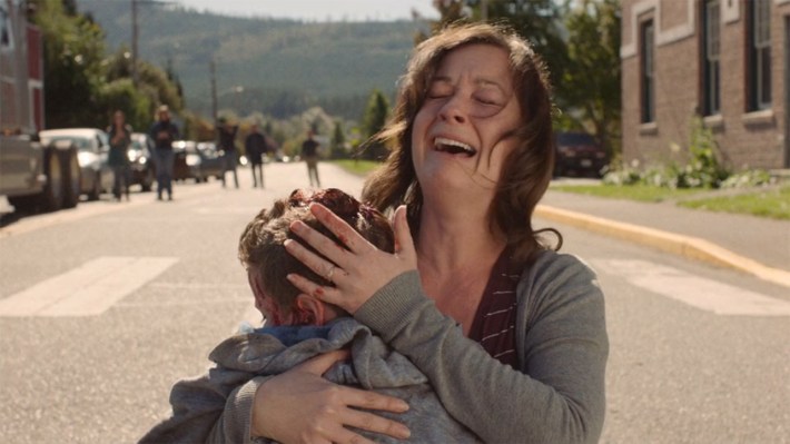 Mother cradling son after hit and run